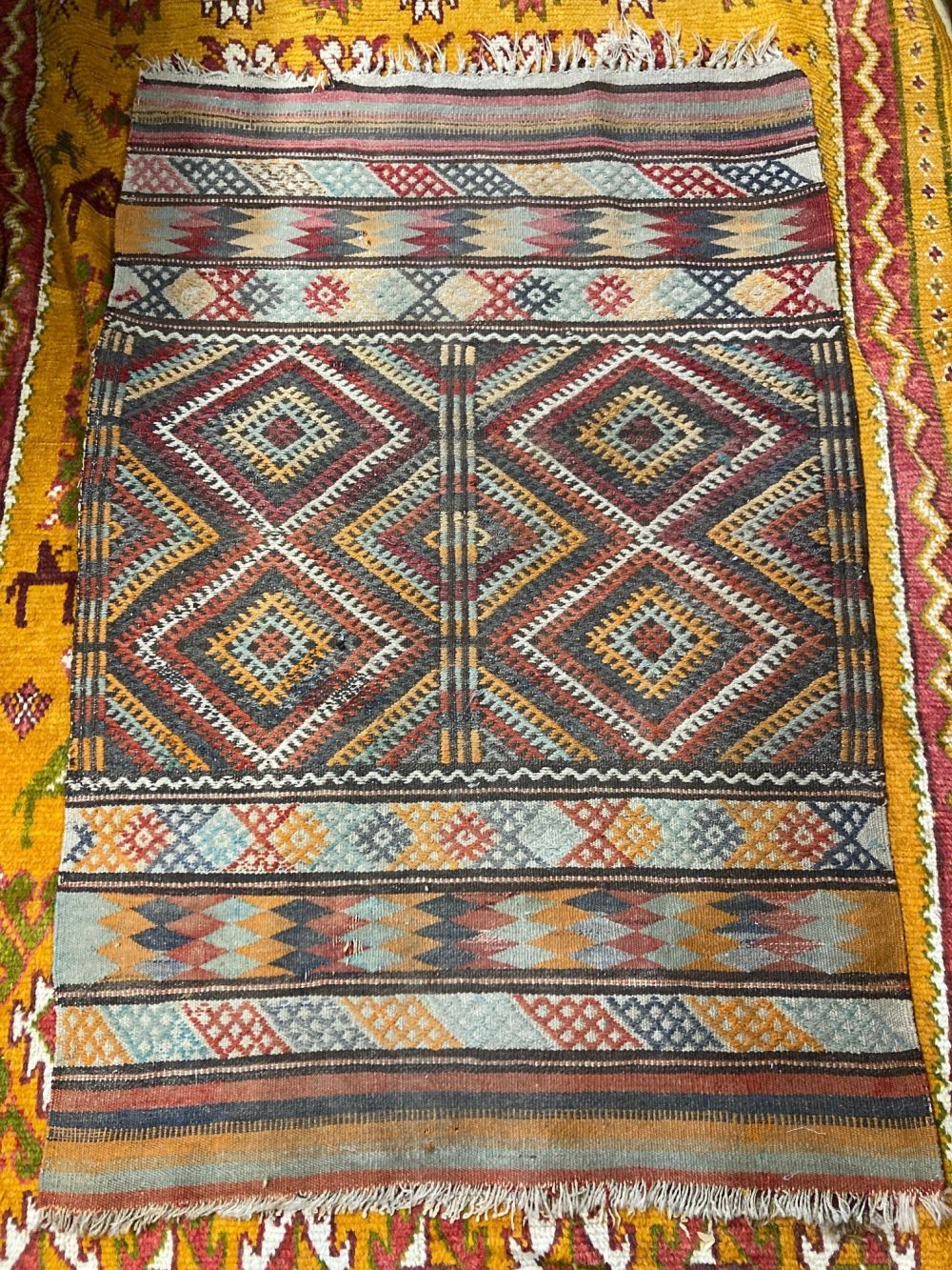 A Kelim and other rugs, largest 240 x 140cm (4)